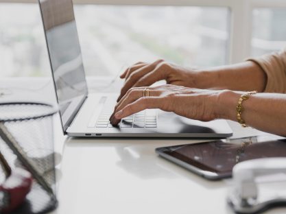 close-up-shot-person-typing-laptop